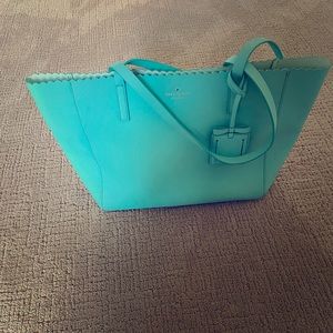 Aqua colored large Kate spade bag.